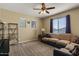 The home features a comfortable living room with plush seating and plenty of natural light at 3936 E Narrowleaf Dr, Gilbert, AZ 85298