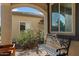 Cozy front patio area featuring a comfortable bench, perfect for enjoying the outdoor ambiance at 3936 E Narrowleaf Dr, Gilbert, AZ 85298