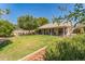 Lush backyard showcasing a well-maintained lawn and covered patio perfect for outdoor enjoyment at 5263 E Hannibal St, Mesa, AZ 85205