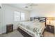 Cozy bedroom featuring a comfortable bed with stylish bedding and matching nightstands at 5263 E Hannibal St, Mesa, AZ 85205