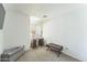 Minimalist bedroom with neutral carpet, a small desk, and natural light from window at 5263 E Hannibal St, Mesa, AZ 85205