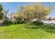 Charming home featuring a well-manicured lawn and mature shade tree at 5263 E Hannibal St, Mesa, AZ 85205