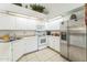 Bright kitchen with white cabinets and stainless steel refrigerator at 5263 E Hannibal St, Mesa, AZ 85205