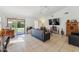 Bright living room with tile flooring and a sliding glass door to backyard at 5263 E Hannibal St, Mesa, AZ 85205