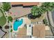 Aerial view showcasing a private pool, lush landscaping, and charming outdoor entertaining area at 5345 E Mclellan Rd # 123, Mesa, AZ 85205