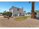 Rear view of the two-story house with a backyard featuring desert landscaping and gravel at 5345 E Mclellan Rd # 123, Mesa, AZ 85205
