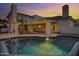 Serene backyard featuring a refreshing pool, covered patio, and spiral staircase, perfect for outdoor living at 5345 E Mclellan Rd # 123, Mesa, AZ 85205
