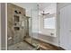 Bright bathroom with glass shower, soaking tub and wood look floors at 5345 E Mclellan Rd # 123, Mesa, AZ 85205