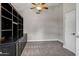 Bedroom features a ceiling fan and a built-in cabinet, adding to storage and character at 5345 E Mclellan Rd # 123, Mesa, AZ 85205