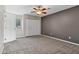 Large bedroom featuring neutral carpeting, a ceiling fan, and a double door closet at 5345 E Mclellan Rd # 123, Mesa, AZ 85205