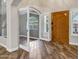 Bright entryway with wood floors, leading to a sunny room with white trim and a classic wood door at 5345 E Mclellan Rd # 123, Mesa, AZ 85205