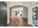 Inviting entryway showcasing wood floors that lead to a spacious living area and a kitchen with modern features at 5345 E Mclellan Rd # 123, Mesa, AZ 85205