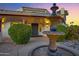 Charming home entrance with a decorative water fountain and stone path at 5345 E Mclellan Rd # 123, Mesa, AZ 85205
