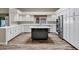 Beautiful kitchen with white cabinets, an island, stainless steel appliances, and wood floors at 5345 E Mclellan Rd # 123, Mesa, AZ 85205