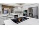 Kitchen featuring stainless steel appliances and an island with an electric cooktop at 5345 E Mclellan Rd # 123, Mesa, AZ 85205