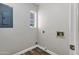 The laundry room has a small window, wood-look floors, and white walls at 5345 E Mclellan Rd # 123, Mesa, AZ 85205