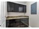 Laundry room with upper and lower cabinets, countertop, and sink at 5345 E Mclellan Rd # 123, Mesa, AZ 85205