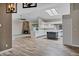 Bright and spacious living room featuring a modern kitchen and cozy fireplace, perfect for entertaining at 5345 E Mclellan Rd # 123, Mesa, AZ 85205