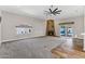 Living room featuring a fireplace, ceiling fan, and sliding glass doors leading to the pool at 5345 E Mclellan Rd # 123, Mesa, AZ 85205