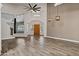 Open living room featuring wood flooring and an archway into the foyer at 5345 E Mclellan Rd # 123, Mesa, AZ 85205