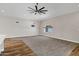 Empty living room with carpet, ceiling fan, and large window at 5345 E Mclellan Rd # 123, Mesa, AZ 85205