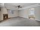 Living room featuring a fireplace, ceiling fan, and doorway to bathroom at 5345 E Mclellan Rd # 123, Mesa, AZ 85205