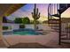 Backyard pool and spa area with string lights and desert landscaping at 5345 E Mclellan Rd # 123, Mesa, AZ 85205