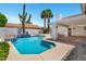 Backyard view featuring a pristine pool, covered patio, lush desert landscaping, and privacy fence at 5345 E Mclellan Rd # 123, Mesa, AZ 85205