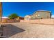 Spacious backyard with rock landscaping, brick walls, and gazebo, perfect for outdoor entertaining and relaxation at 5675 S 239Th Ln, Buckeye, AZ 85326