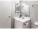 Bathroom showcasing a vanity with updated faucet, modern countertop, and white cabinets at 5675 S 239Th Ln, Buckeye, AZ 85326
