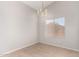 Dining room with tile floors, chandelier, and window with blinds at 5675 S 239Th Ln, Buckeye, AZ 85326