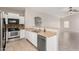 Kitchen with stainless steel appliances, double sink, and tan countertops at 5675 S 239Th Ln, Buckeye, AZ 85326