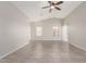 Spacious living area with vaulted ceiling, neutral paint, tile floors and natural light at 5675 S 239Th Ln, Buckeye, AZ 85326