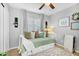 Comfortable bedroom featuring a daybed, decorative pillows, and a neutral color palette at 5711 E Gable Ave, Mesa, AZ 85206
