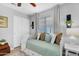 Comfortable bedroom featuring a daybed, decorative pillows, and a neutral color palette at 5711 E Gable Ave, Mesa, AZ 85206