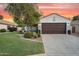 Charming single-Gathering home with mature trees, a well-manicured lawn, and a two-car garage at 5711 E Gable Ave, Mesa, AZ 85206