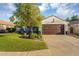 Charming single-Gathering home with mature trees, a well-manicured lawn, and a two-car garage at 5711 E Gable Ave, Mesa, AZ 85206