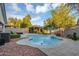 Backyard pool area features a sparkling pool, covered gazebo, and lush greenery at 5711 E Gable Ave, Mesa, AZ 85206