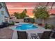 Private backyard with a sparkling pool, lush landscaping, and covered patio at 5711 E Gable Ave, Mesa, AZ 85206