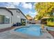 Beautiful backyard with a sparkling pool, gazebo, patio, and well-manicured landscaping at 5711 E Gable Ave, Mesa, AZ 85206