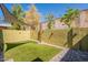 Backyard is complete with artificial turf and modern brick privacy fence at 602 E Colgate Dr, Tempe, AZ 85283