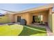 Artificial turf backyard with BBQ grill, shade sail, and covered patio at 602 E Colgate Dr, Tempe, AZ 85283