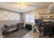 Bedroom features a ceiling fan, wood-look flooring, and a window for natural light at 602 E Colgate Dr, Tempe, AZ 85283