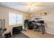 Bedroom features a ceiling fan, wood-look flooring, and a window for natural light at 602 E Colgate Dr, Tempe, AZ 85283