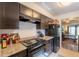 Modern kitchen with granite countertops and black appliances at 602 E Colgate Dr, Tempe, AZ 85283