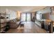 Stylish living room boasting hardwood floors, a comfortable sofa, entertainment center, and sliding glass doors at 602 E Colgate Dr, Tempe, AZ 85283