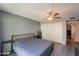Bedroom features wood-look flooring, a slider to the backyard, and a ceiling fan at 602 E Colgate Dr, Tempe, AZ 85283