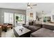 Cozy living room with a large sectional sofa, modern decor, and natural light at 605 W Sandra Terrace Ter, Phoenix, AZ 85023