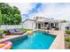 Backyard with a sparkling pool, lounge area, and well-manicured lawn for outdoor enjoyment at 605 W Sandra Terrace Ter, Phoenix, AZ 85023