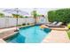Inviting backyard features a sparkling pool, lounge chairs, and lush landscaping, perfect for relaxation at 605 W Sandra Terrace Ter, Phoenix, AZ 85023